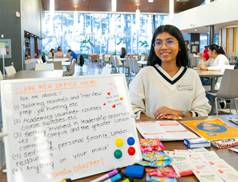 Residence Education Advisor sitting at their table
