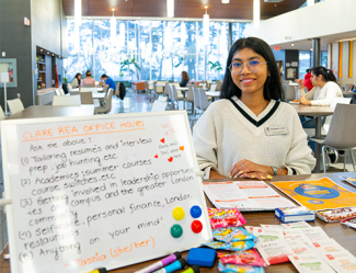 Residence Education Advisor sitting at their table